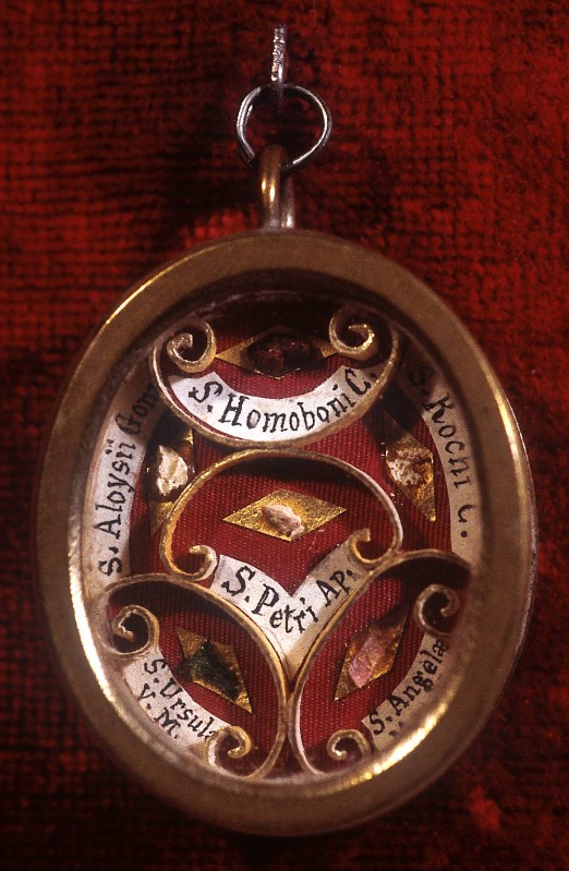 Ambito lombardo sec. XIX, Reliquiario a medaglione di S. Omobono e altri